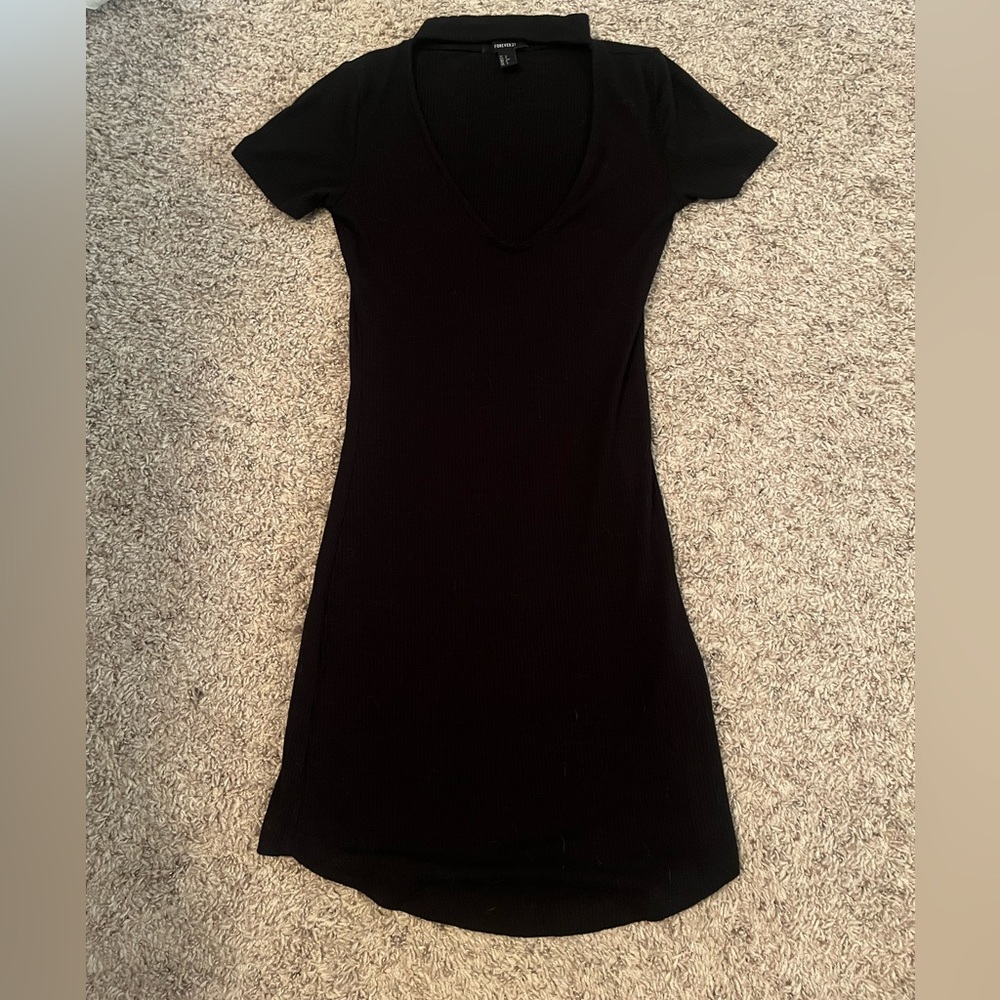 Black mini dress- I am 5’1 for reference. It has a neck choker thing attached
